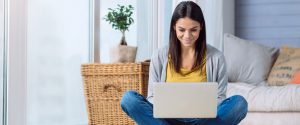 Girl on floor with laptop_wide