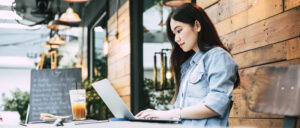 asian woman working and enjoy weekend with online social connection