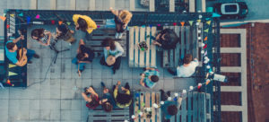 Friends listening to a music band on the rooftop