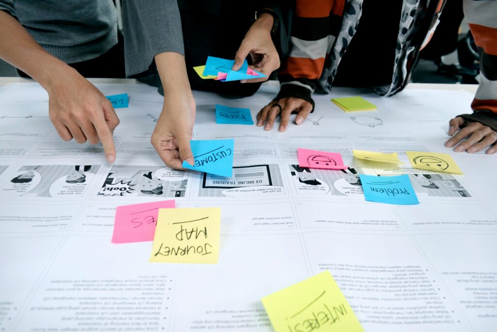 7 steps to map the customer journey laying out post-it notes on documents