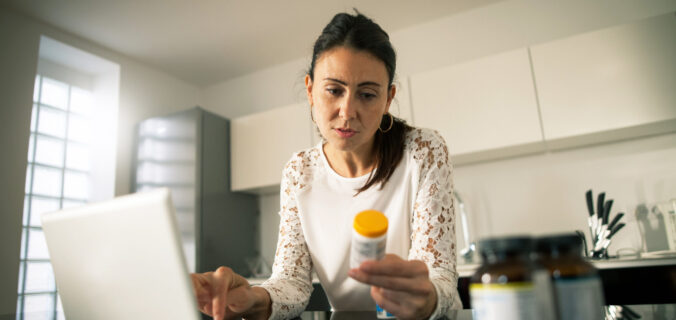 woman checking her medicine